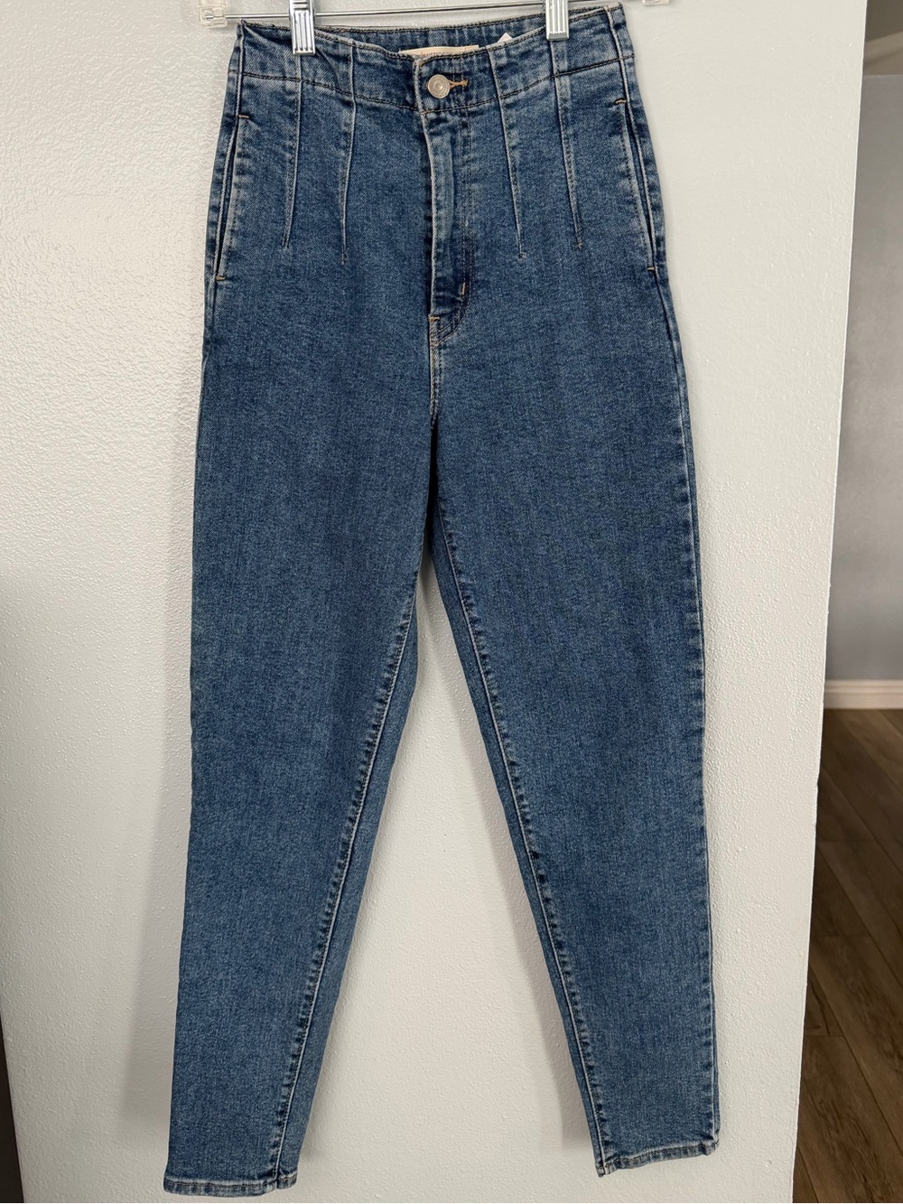 Levi’s high-waisted, medium-wash blue denim jeans